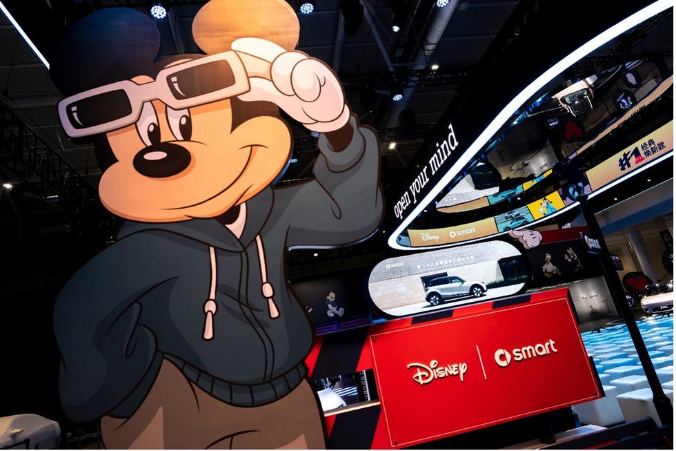 promotional display featuring mickey mouse and car elements