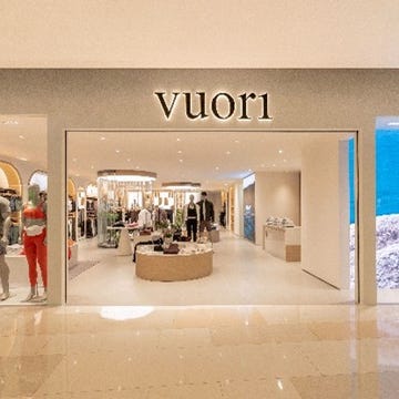 retail storefront featuring the brand vuori1 with mannequins displaying apparel retail storefront featuring the brand vuori1 with mannequins displaying apparel