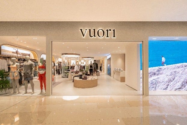 retail storefront featuring the brand vuori1 with mannequins displaying apparel