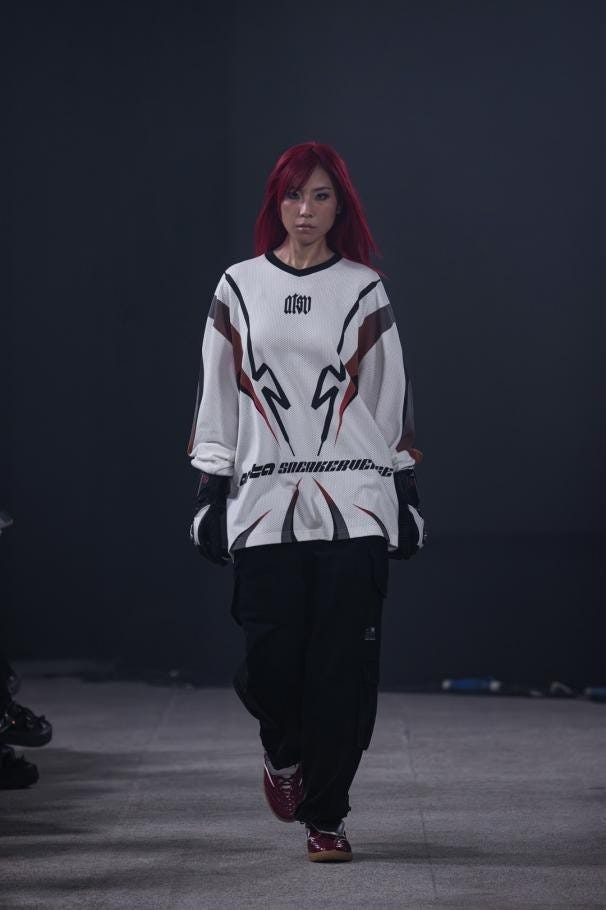 model walking on a runway showcasing streetwear fashion