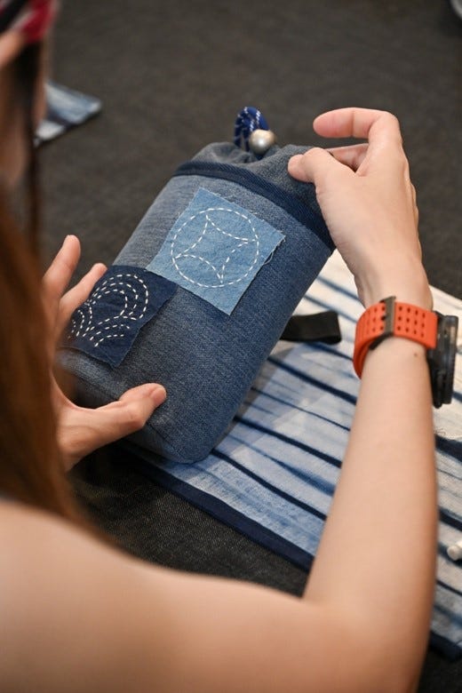 crafting session focused on stitching techniques using denim
