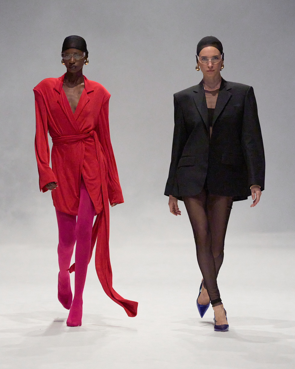 a man and woman in a red suit