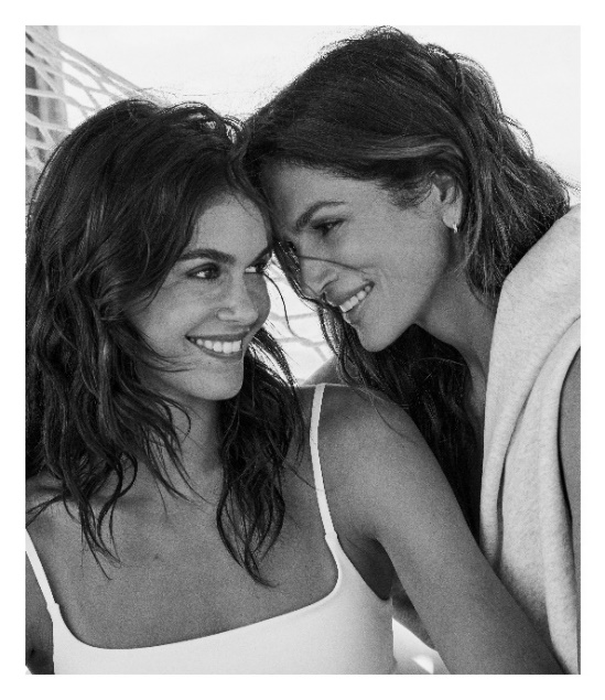 two individuals closely positioned with their arms around each other captured in a monochrome setting