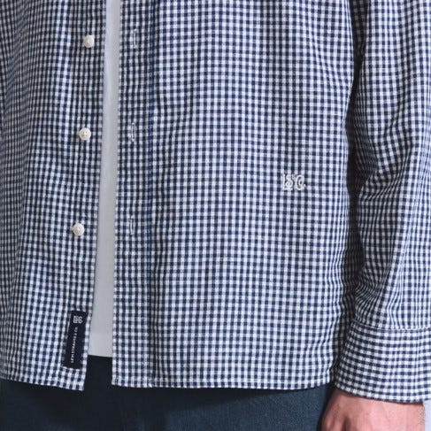 checkered buttonup shirt with a logo