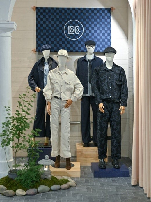 display of fashion outfits on mannequins