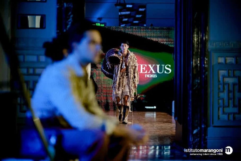 fashion model showcasing clothing on a runway