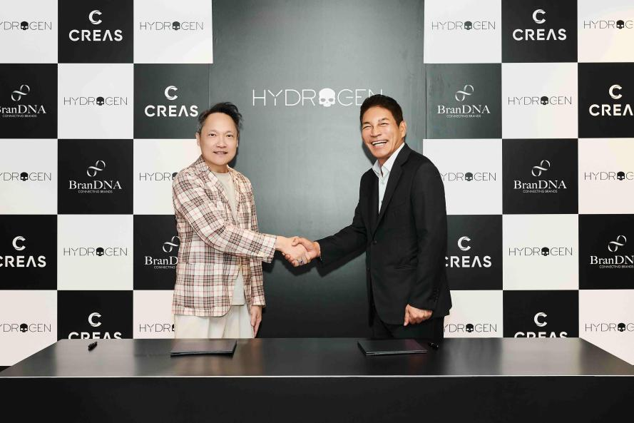 business partnership handshake at a press event