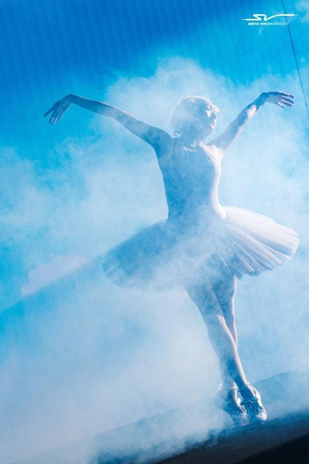 ballet dancer performing gracefully amidst fog