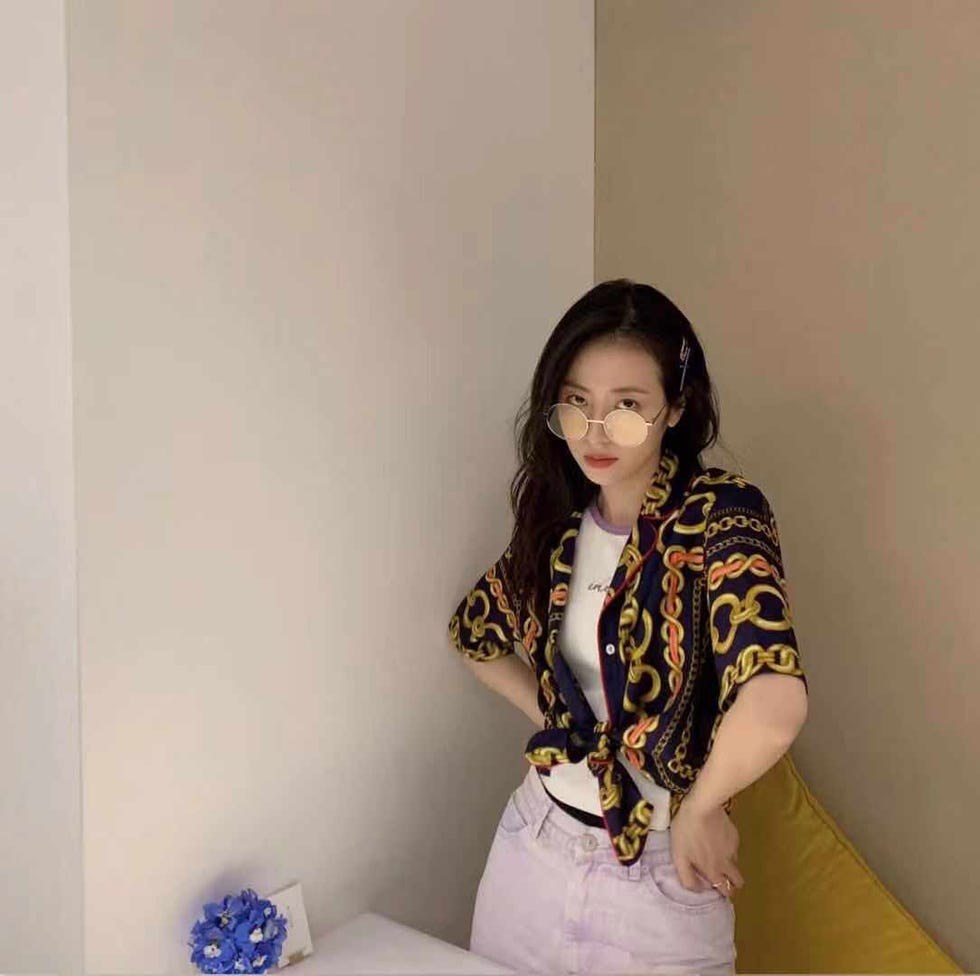 White, Yellow, Shoulder, Long hair, Black hair, Outerwear, Room, Smile, Sitting, Photography, 
