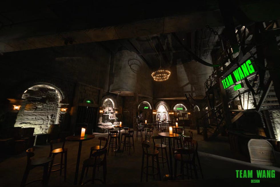 a group of tables and chairs in a dark room