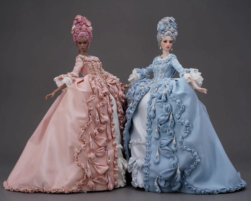 a pair of mannequins in dresses
