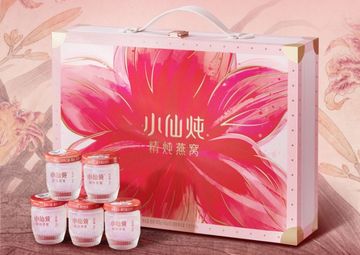 gift box containing skincare jars with floral design