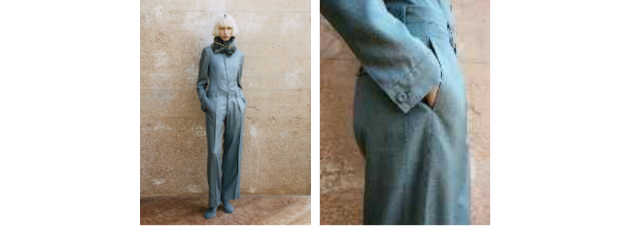 a mannequin wearing a blue jumpsuit with a scarf
