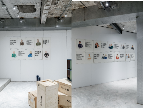 wall displaying illustrated posters with text in a gallery space