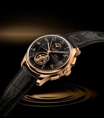 luxury wristwatch featuring a tourbillon mechanism and black leather strap