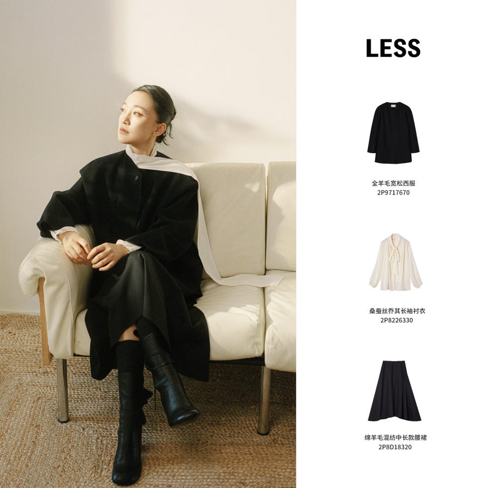 fashionable outfit showcase featuring a dark coat and stylish attire