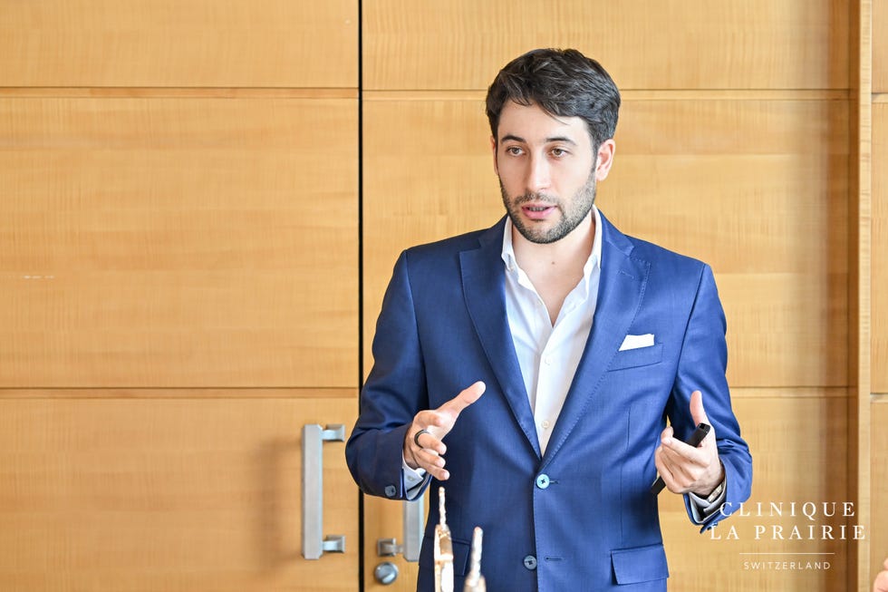professional presentation setting with a speaker engaged in discussion