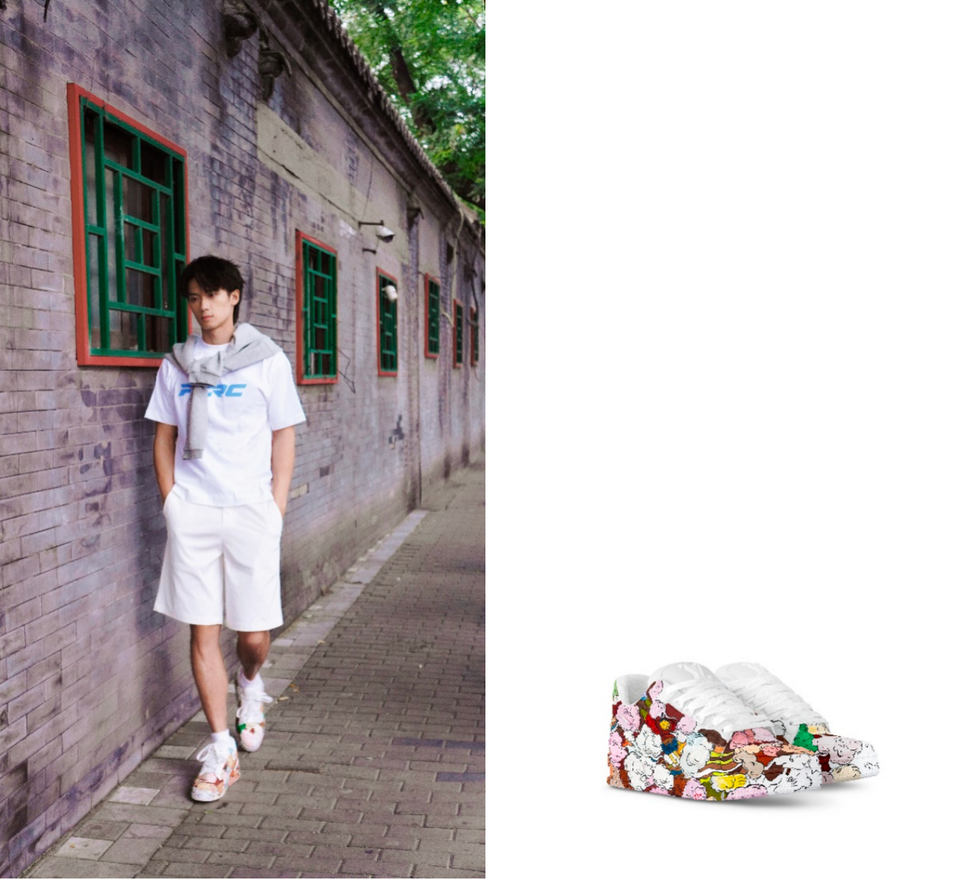urban scene with a person walking along a brick wall and colorful shoes displayed