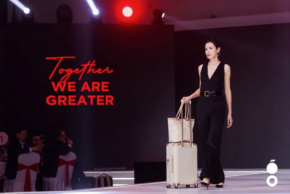 fashion event featuring a model on the runway