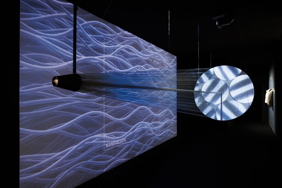 installation featuring dynamic projections and an abstract object