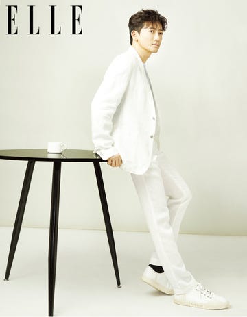 White, Clothing, Suit, Standing, Formal wear, Sitting, Leg, Tuxedo, Furniture, Outerwear, 