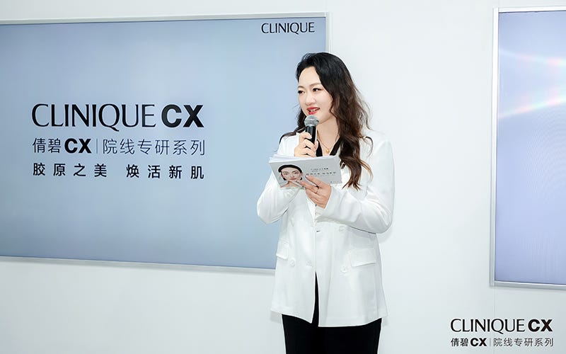 presentation event for clinique cx with a speaker holding notes
