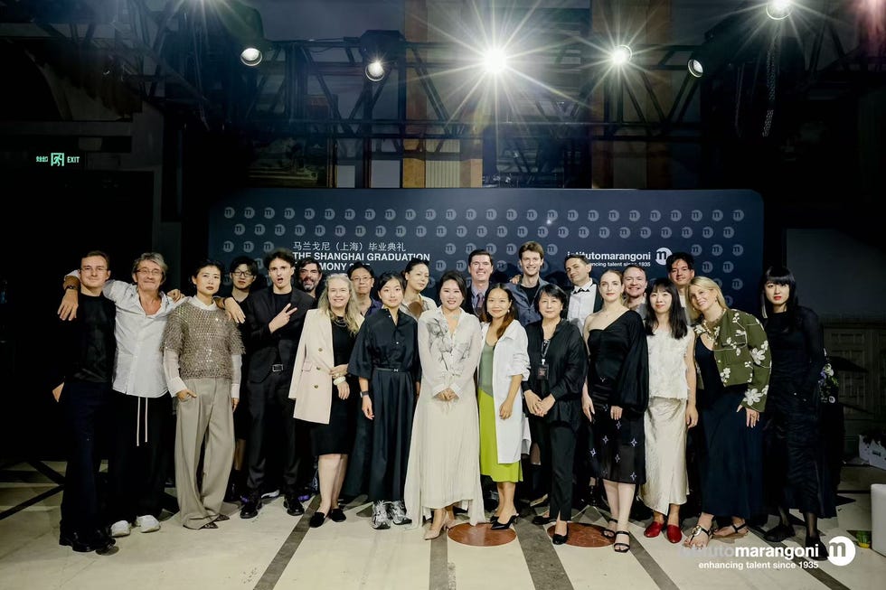 group photo at a graduation ceremony in shanghai with attendees dressed in formal and stylish attire