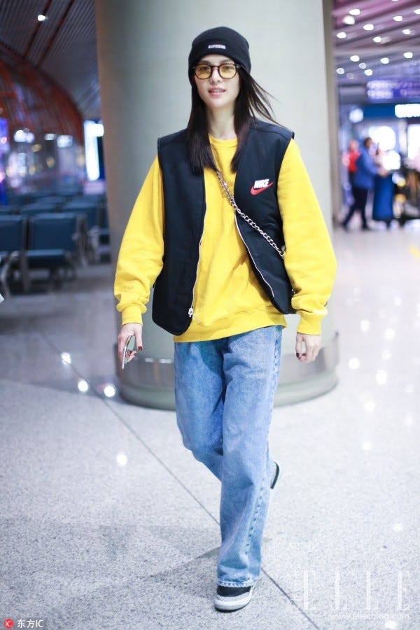 Clothing, Street fashion, Yellow, Jeans, Fashion, Snapshot, Outerwear, Beanie, Electric blue, Denim, 