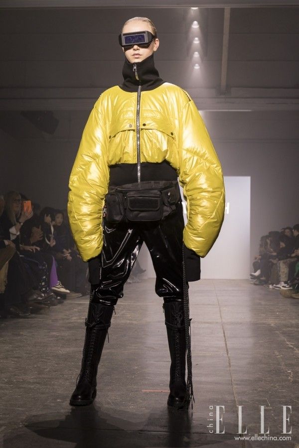 Fashion, Yellow, Outerwear, Latex clothing, Runway, Fashion show, Latex, Leather, Jacket, Personal protective equipment, 