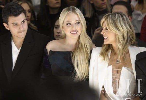 Hair, Facial expression, Event, Blond, Hairstyle, Fashion, Long hair, Smile, Photography, Suit, 