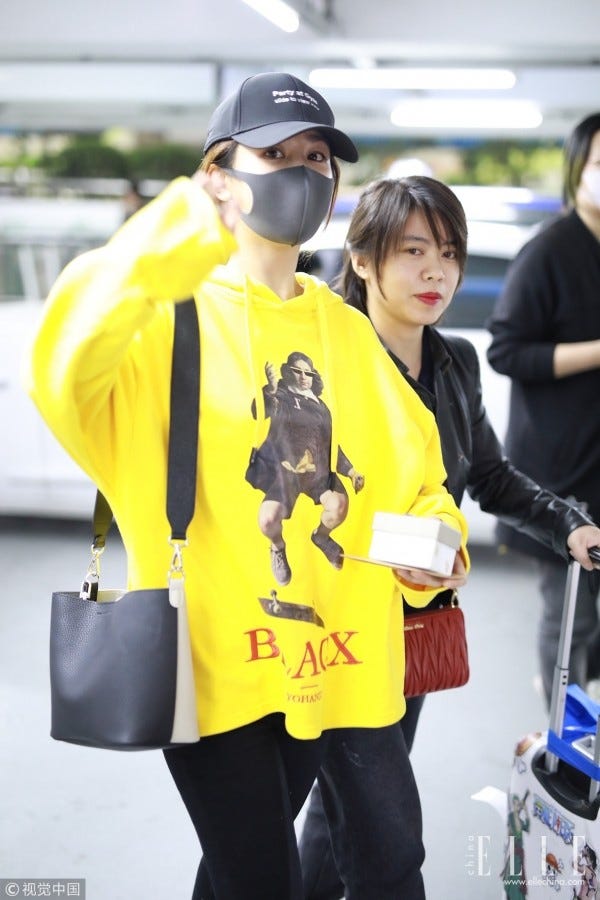 Yellow, Street fashion, Outerwear, Snapshot, Footwear, Jacket, Fashion accessory, Sleeve, Costume, Spandex, 